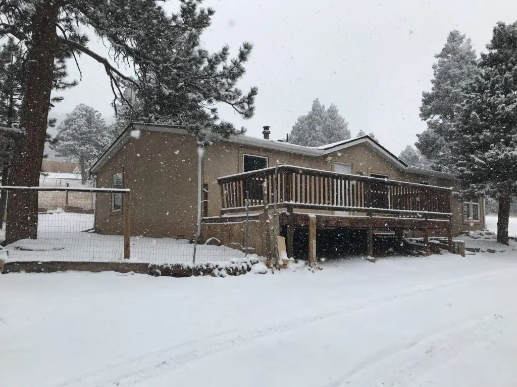 Colorado house in winter with delinquent property taxes